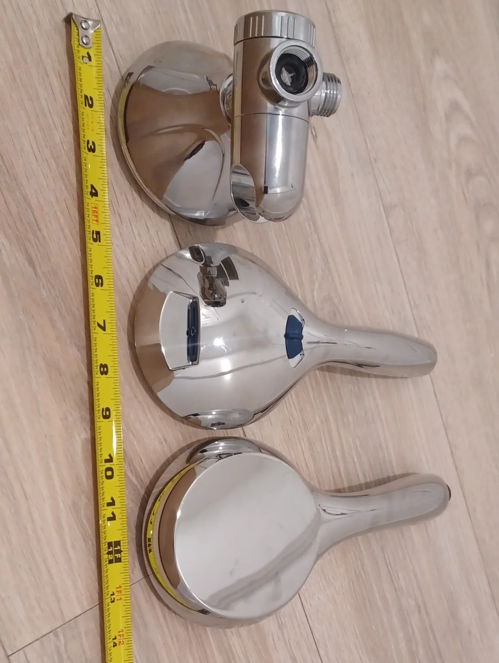 Bundle of chrome shower heads with flexible hose. Bath. Hand held.